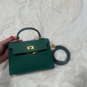 Top handle green bag with gold hard wear
